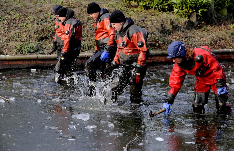 Police search teams break the ice to search the lake in a park close to Shannon's home after she went missing