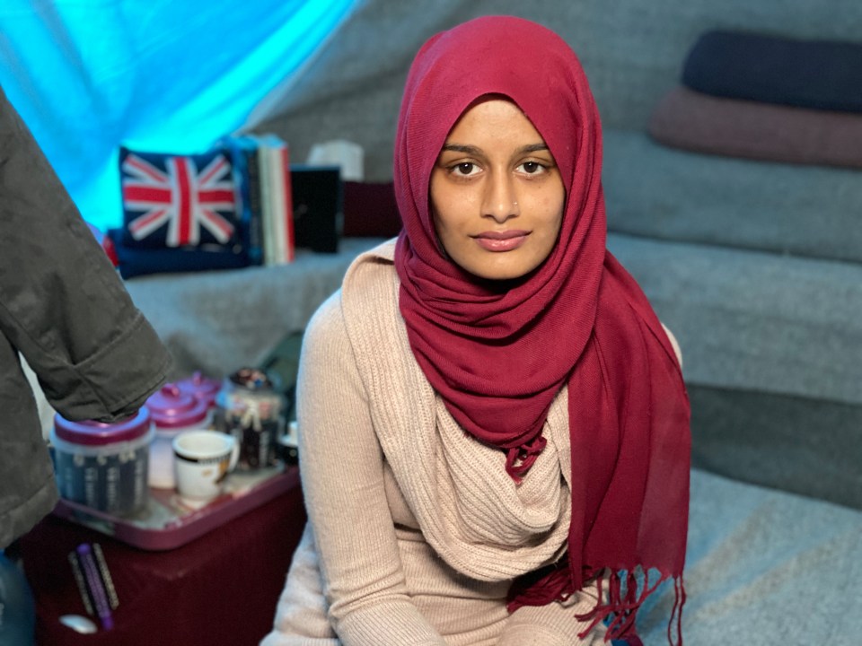 Shamima Begum poses in her tent with a Union Jack pillow