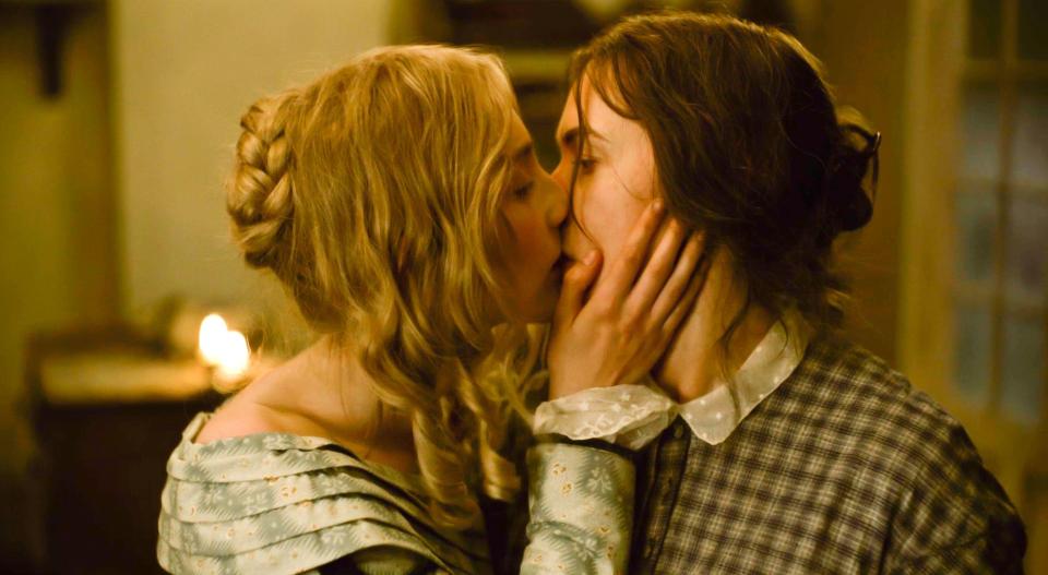 Saoirse Ronan and Kate Winslet kiss in a scene from Ammonite, due out in April