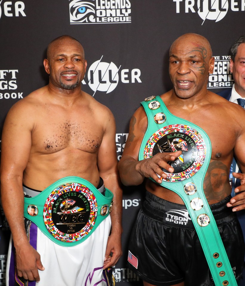 Mike Tyson pictured with Roy Jones Jr