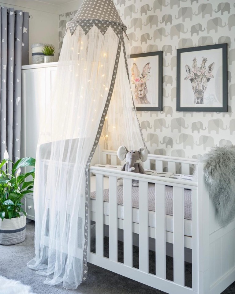  Santiagos cot is surrounded by animal prints and even elephant wallpaper