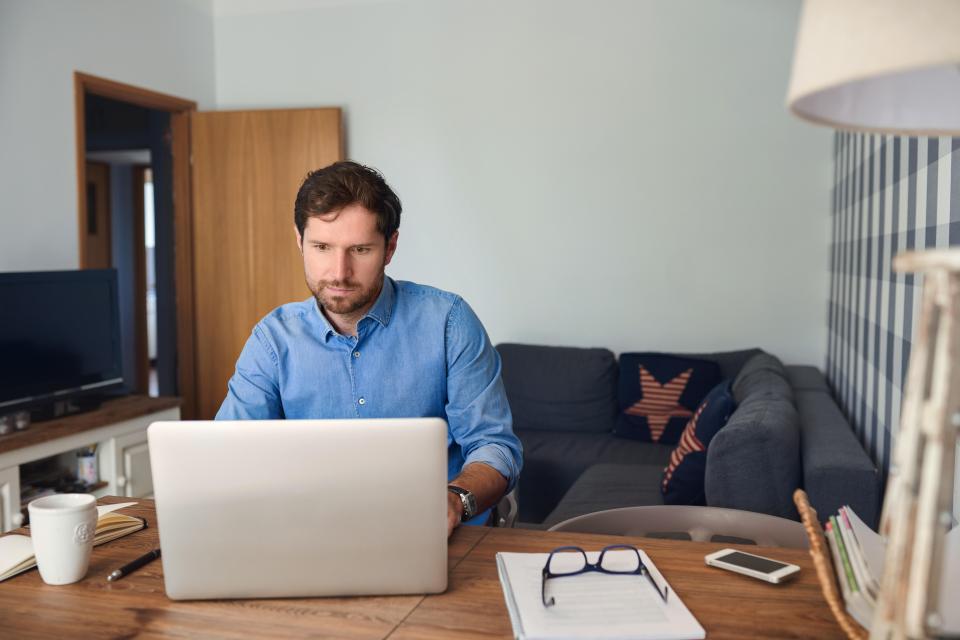 Some studies though have claimed productivity is reduced if workers log in from home rather than the office (file photo)