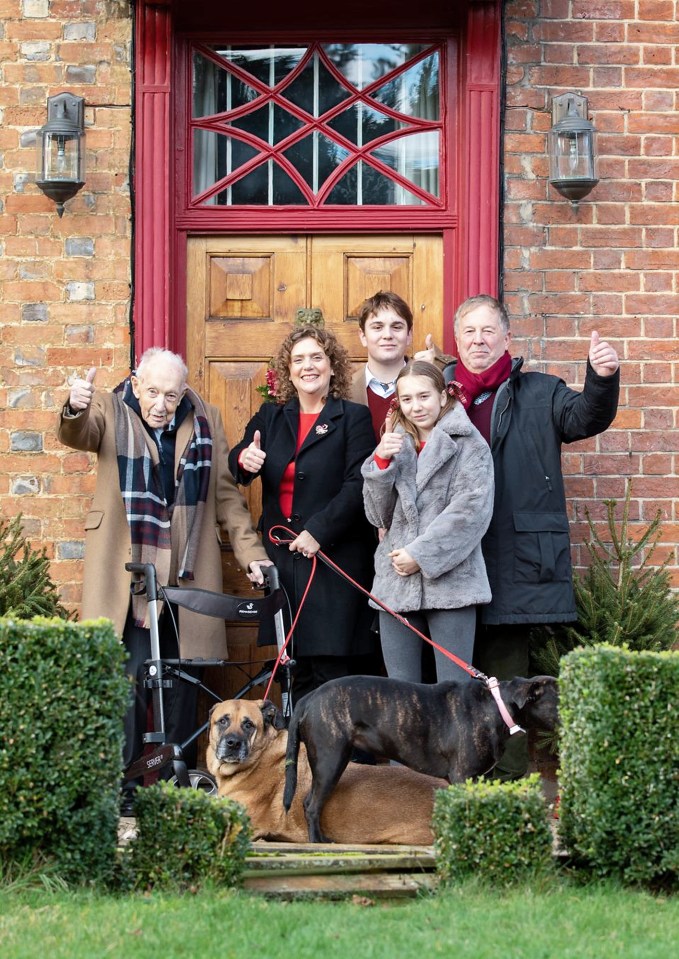 Captain Tom and family give the thumbs-up