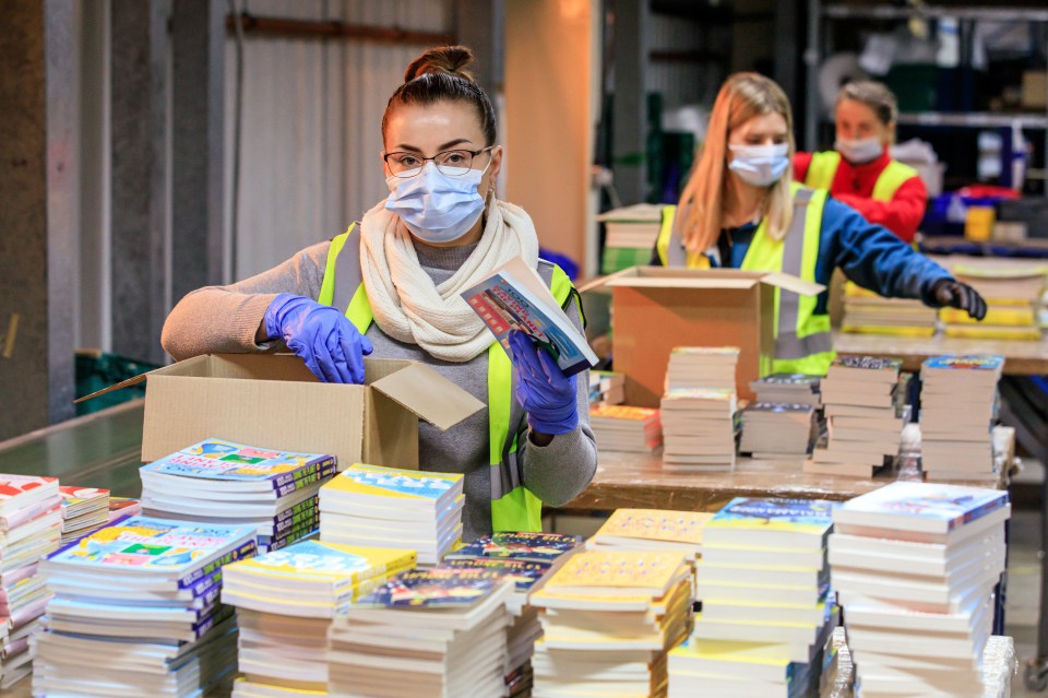 Katarzyna Diakowska packs books at EC Group in Grays