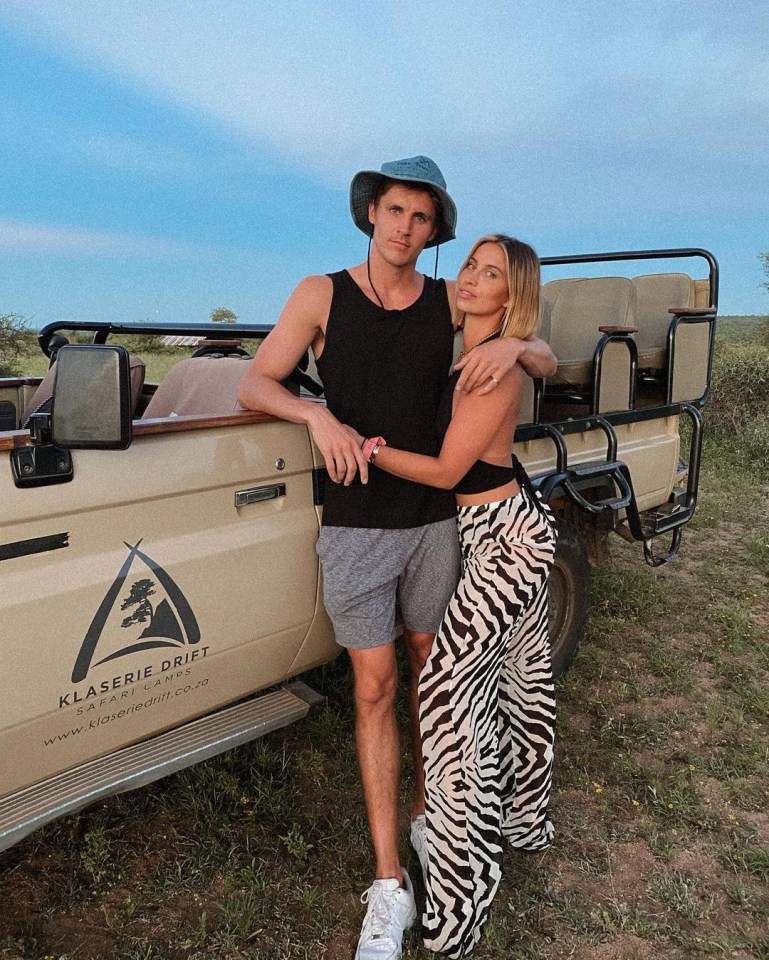 Ferne and Jake beside a jeep