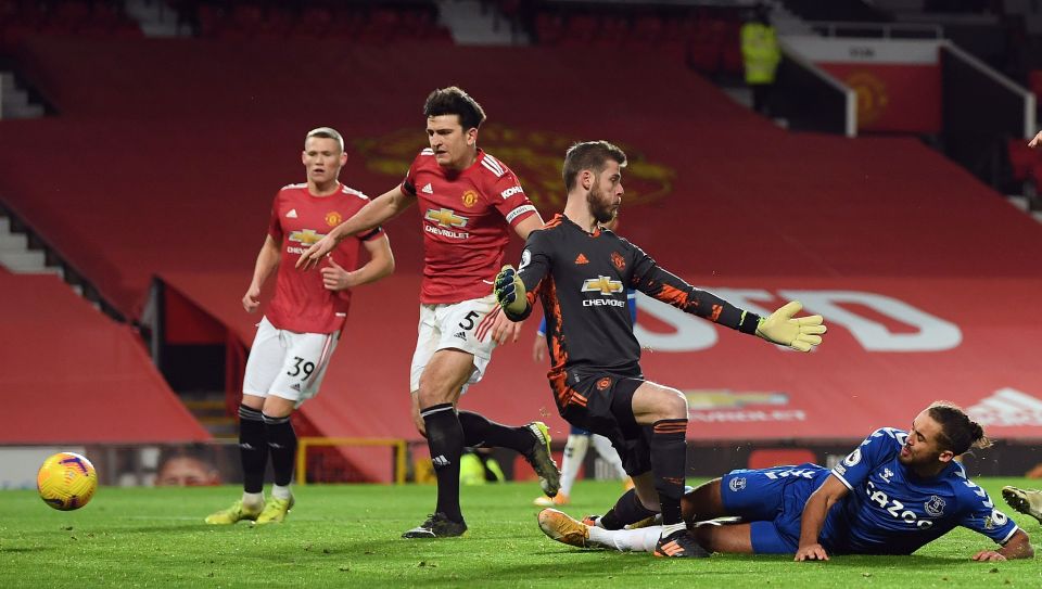 Dominic Calvert-Lewin slides the ball past De Gea