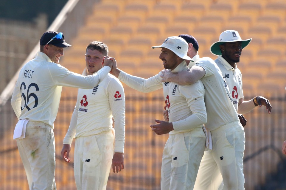 Joe Root celebrates with Jack Leach after he caught Rishabh Pant off Bess