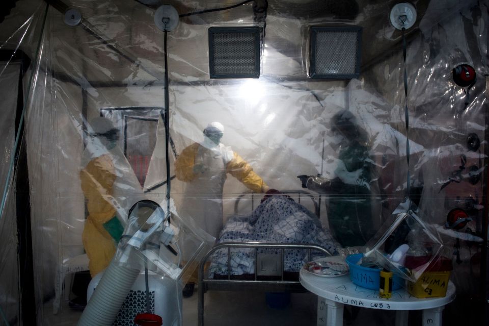 Medical workers care for an Ebola patient in 2018 during Congo's most recent outbreak which was declared over last year