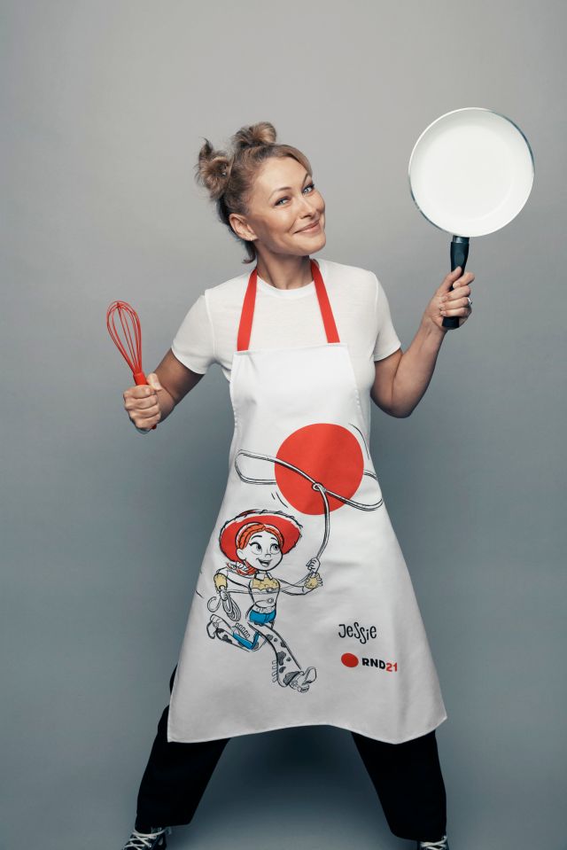 Emma Willis grabbed a frying pan and whisk while wearing a Toy Story apron