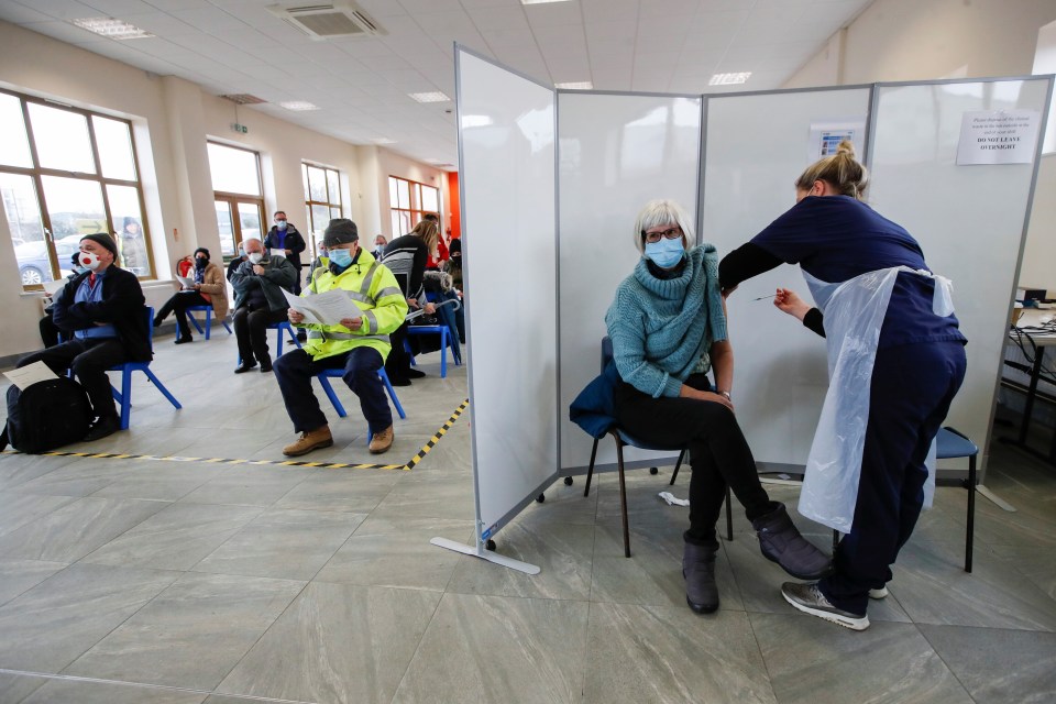 A woman receives the vaccine today at The Guru Nanak Temple in Bedford