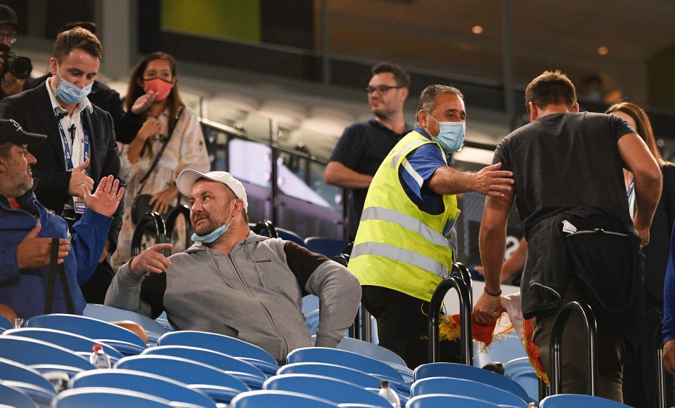 Fans were escorted out during the fourth set