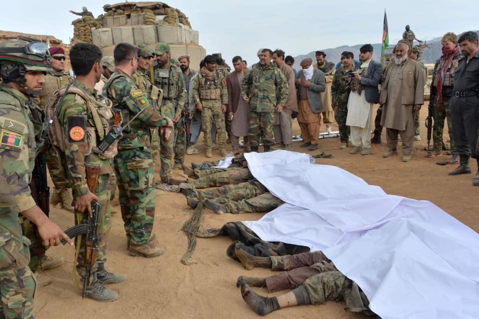 Taliban fighters lie dead after an air strike in Nangarhar