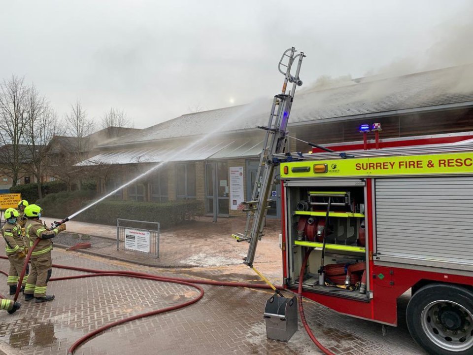 The fire is confined to the roof of the building