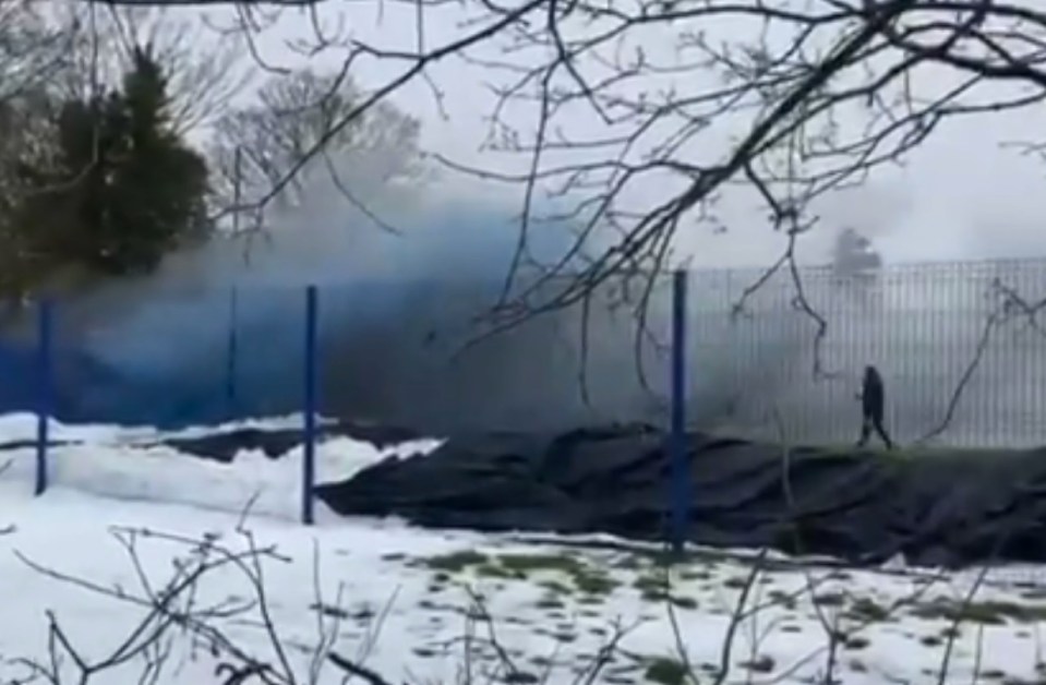 Smoke billowed onto the training ground and the players had to be led away