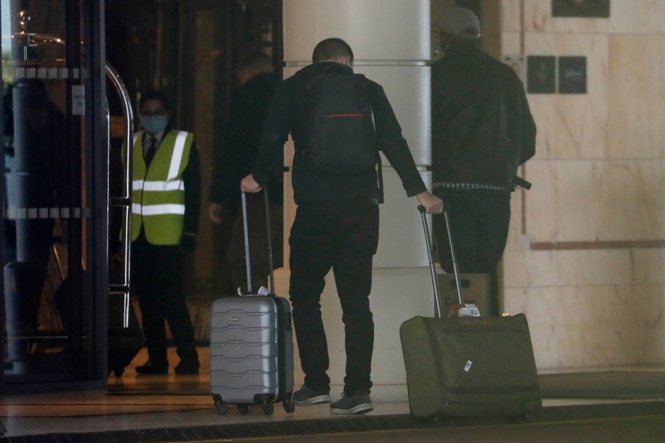 Passengers arrive at the Radisson Blu Edwardian Hotel, near London's Heathrow Airport