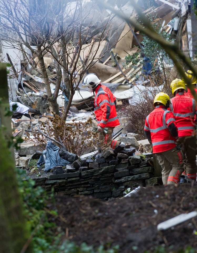 Emergency crews inspect the scene