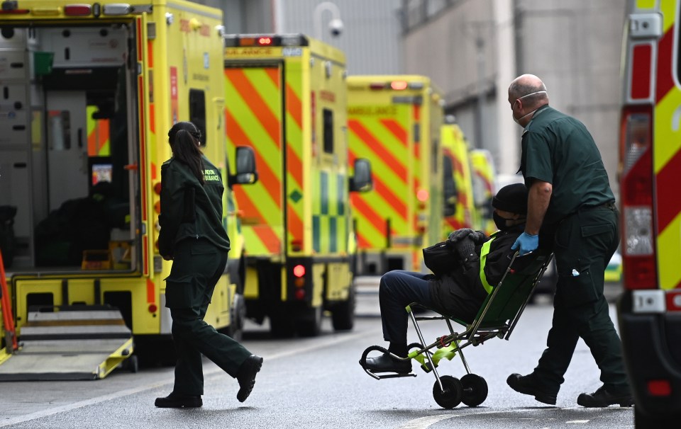 Ambulances staff tend to patients outside the the Royal London hospital