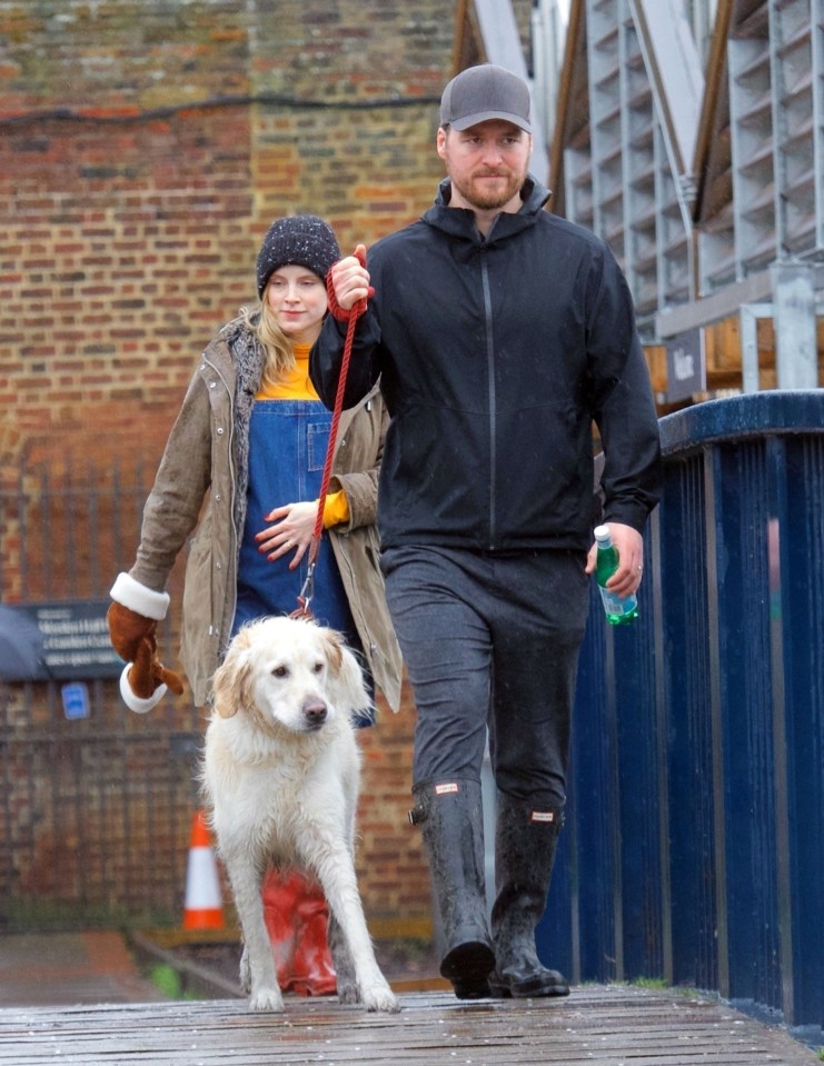 She showed off the bling on a wintry walk with Matt and their dog Buddy