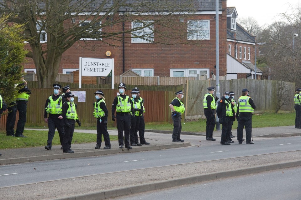 Onlookers estimated that there were roughly three police officers to one mourner