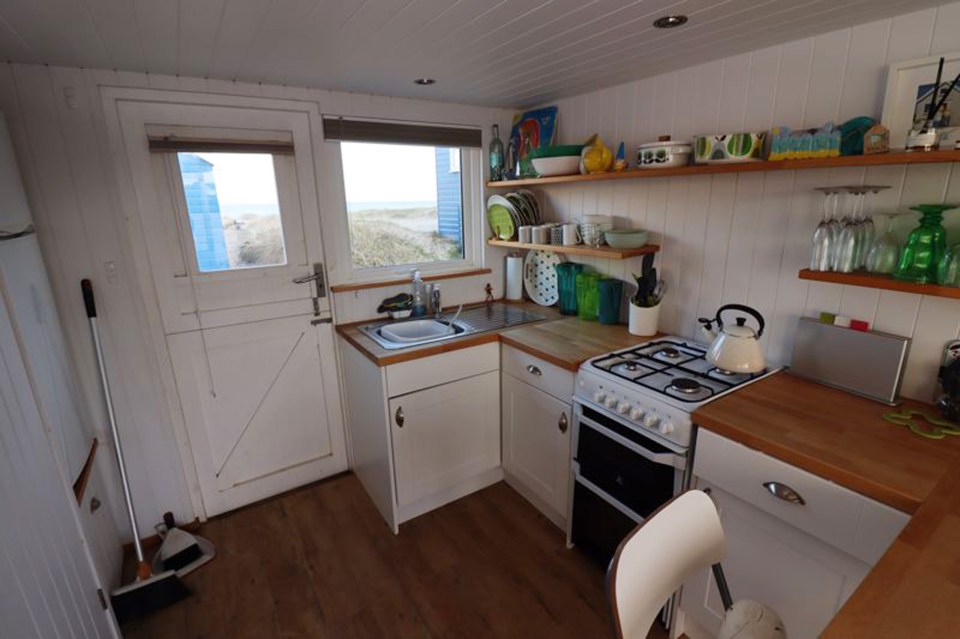 The hut has a lounge area and a fully fitted modern kitchen