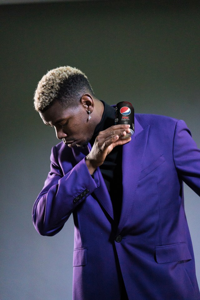 Pogba dabs with a can of the popular fizzy drink