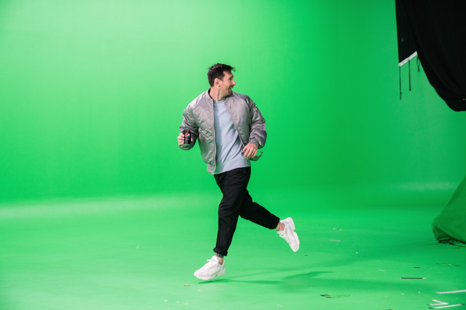 Messi shows off his footwork with a can in hand