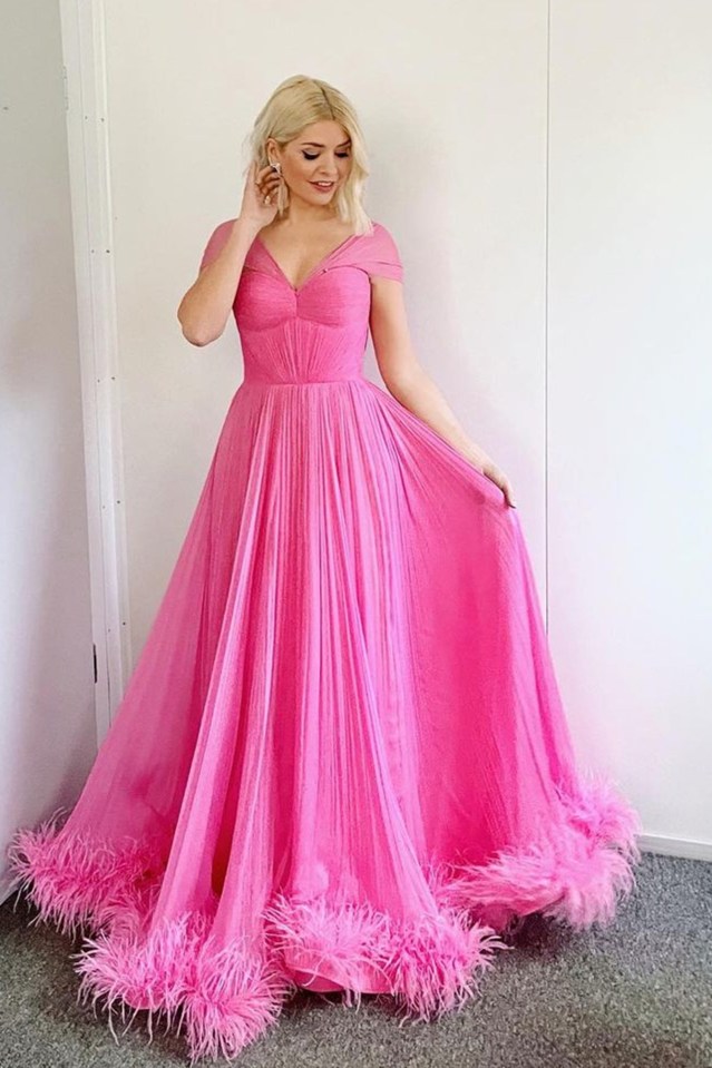 Holly Willoughby stuns in daring low cut bright pink dress on Dancing on Ice