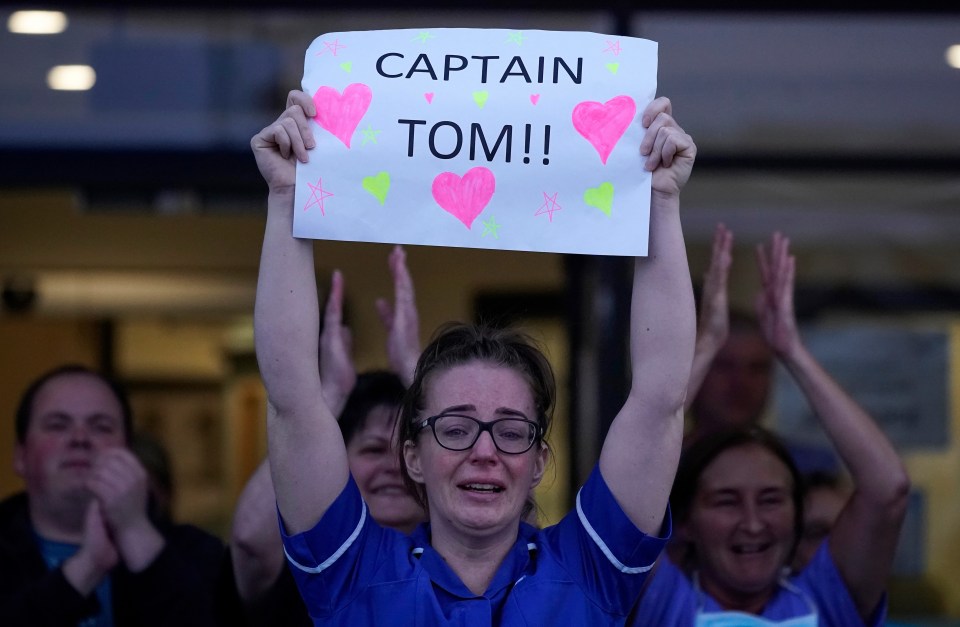 A nurse shows her love of Captain Tom during Clap for Our Carers during the first lockdown