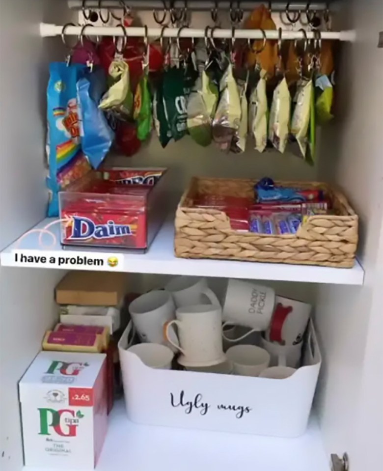 From packs of crisps hanging from pegs to chocolate bars in baskets, the mum-of-three's cupboard is so tidy it might make you think twice about your own