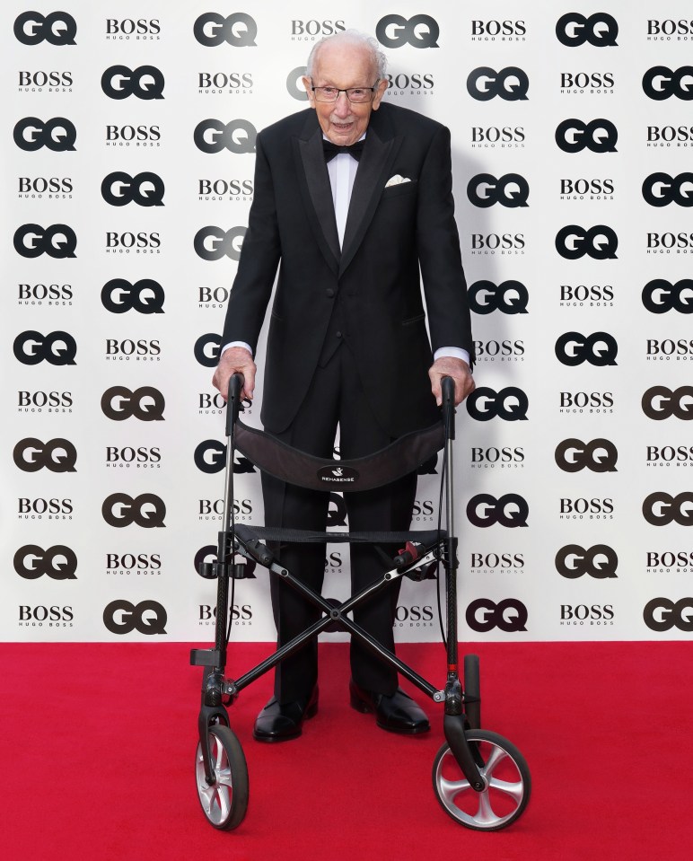 Sir Tom poses on a red carpet for the GQ Men of the Year Awards 2020