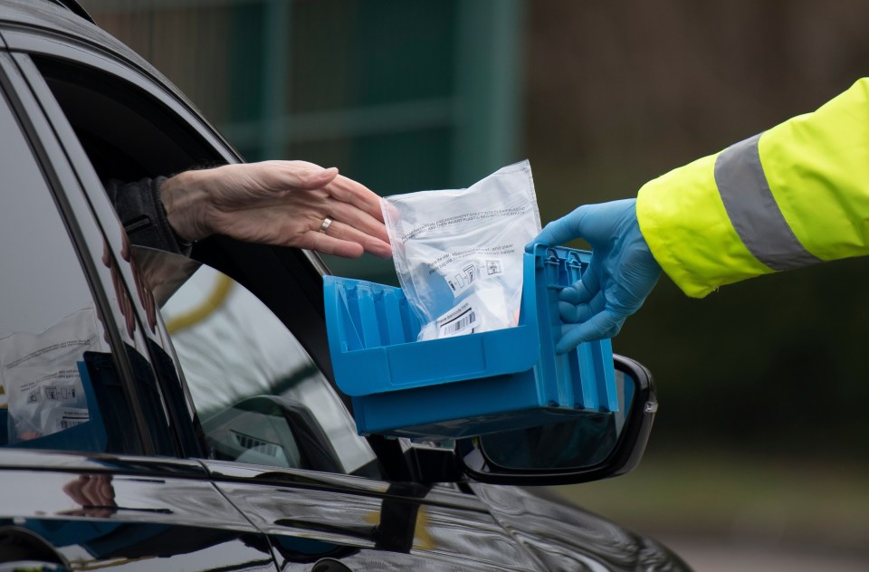 A coronavirus test is handed out at Stoke Gifford, South Gloucestershire