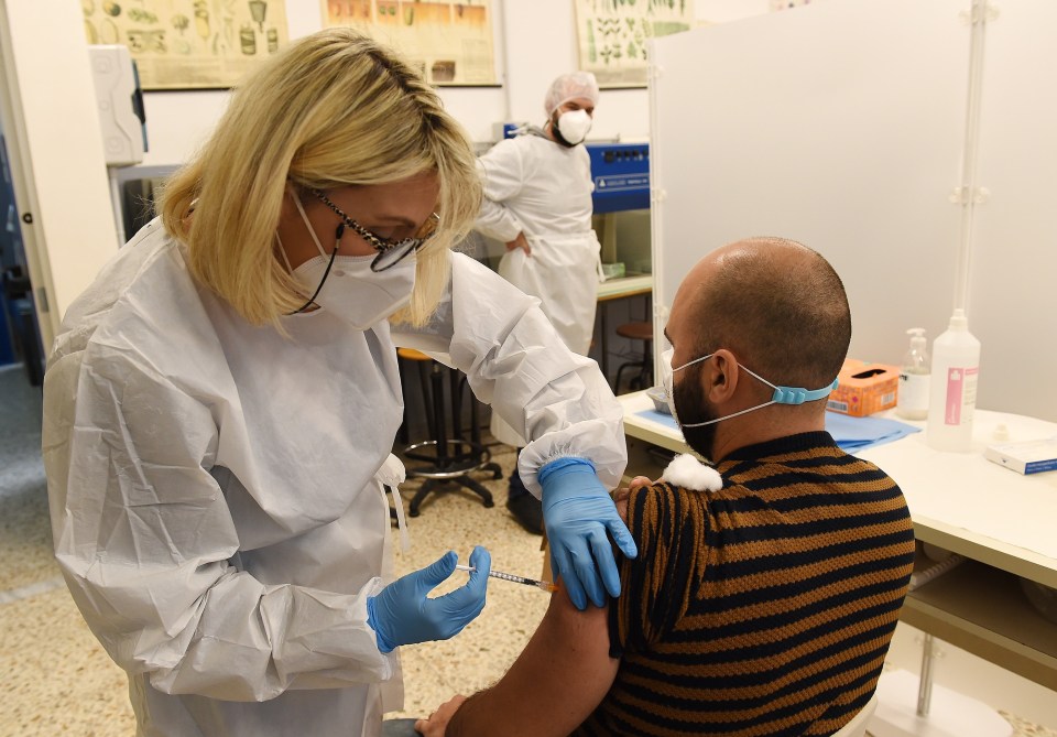 A man getting the AstraZeneca jab in Italy, one of the countries to resume the roll out