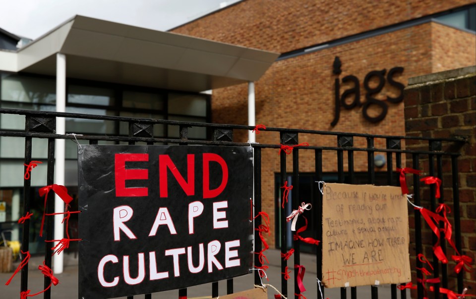 A placard saying 'End Rape Culture' attached to the fence outside James Allen's Girls' School 