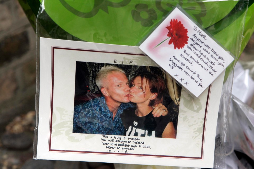 Flowers and tributes outside the entrance to the flat Mark Speight shared with his girlfriend Natasha in St Johns Wood, London