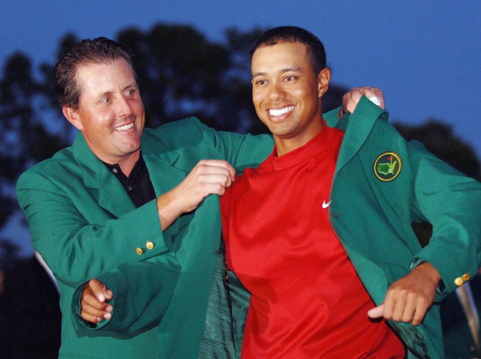 A roaring Tiger Woods won two of the four golfing majors, including his fourth Masters green jacket