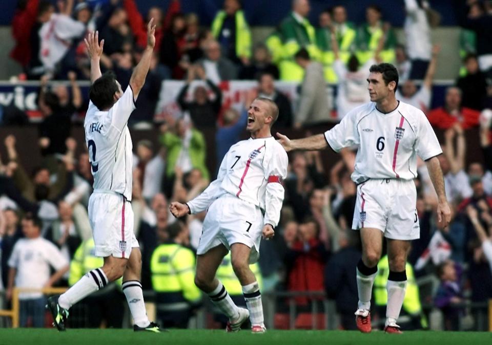 David Beckham celebrating with United and England mate Gary Neville after his free-kick against Greece at Old Trafford in 2001