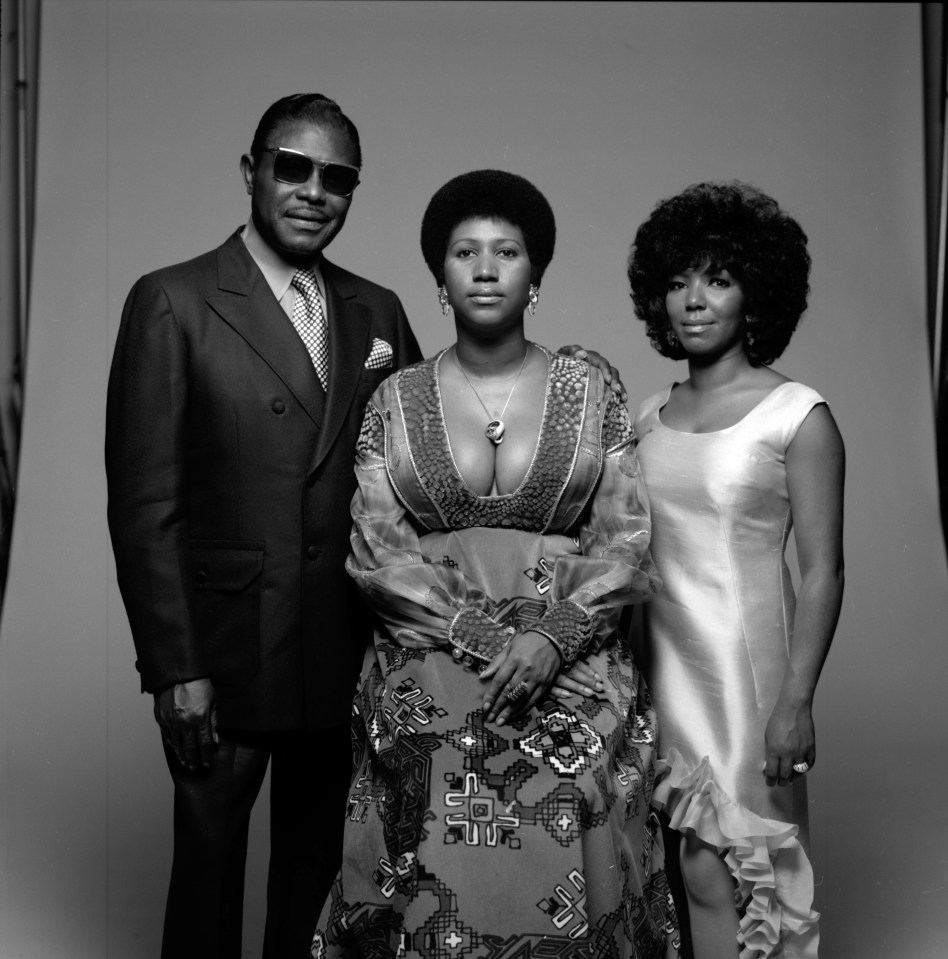 Aretha Franklin, centre, with her father, Baptist preacher CL, left, and sister, fellow singer Carolyn