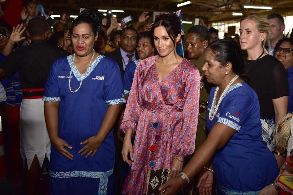 The then-pregnant duchess was led away from the crowds