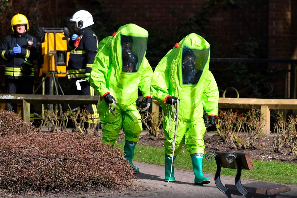 Emergency services wear green biohazard encapsulated suits