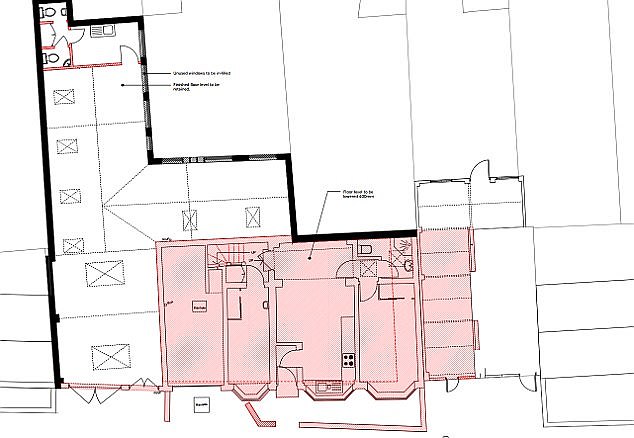 The area in red shows the part of May's property that has been bulldozed as work begins