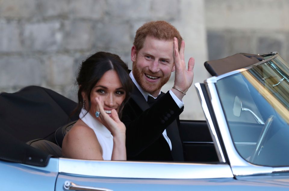 Harry and Meghan are seen here heading to their reception