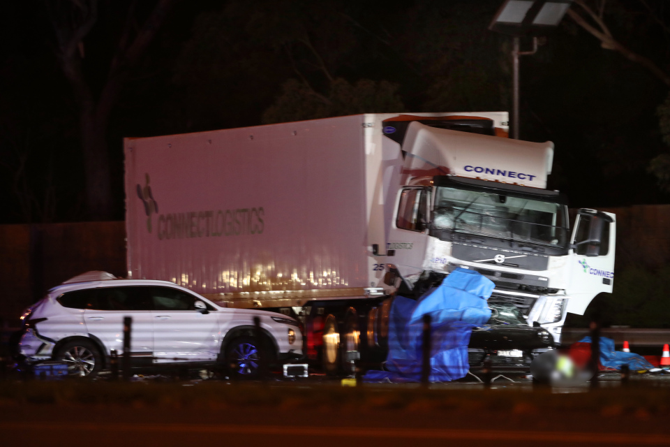 Four police officers were hit by a passing lorry, which had veered out of its lane, while arresting him