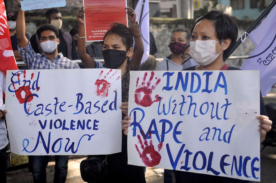 Activists hold placards during a demonstration against death of a 19-year-old Dalit woman, who was allegedly gang-raped by four men