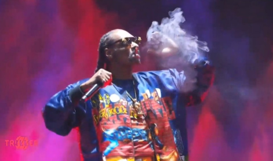 Snoop Dogg smoking on stage while performing