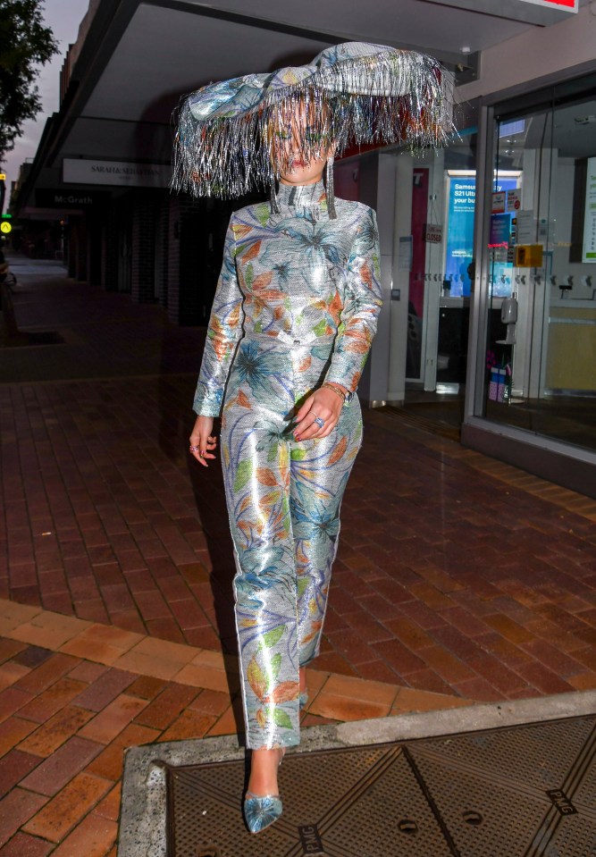 Rita Ora stepped out in style in Sydney glittering in a silver outfit