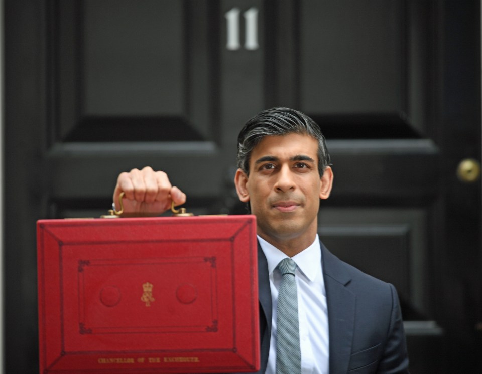 The Chancellor outside No11 with his box as he warned that Covid had hit the economy hard