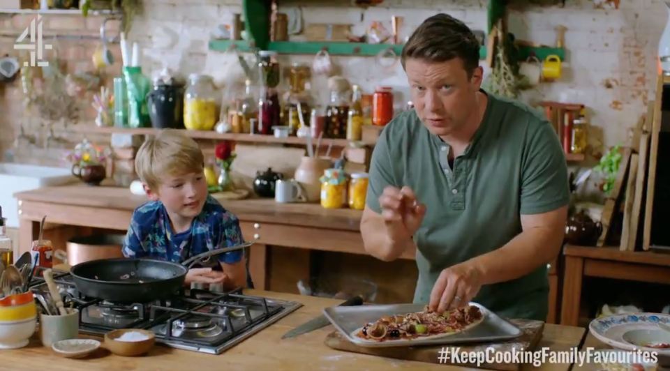 Jamie Oliver, with son Buddy, has horrified fans by putting grapes on a pizza.