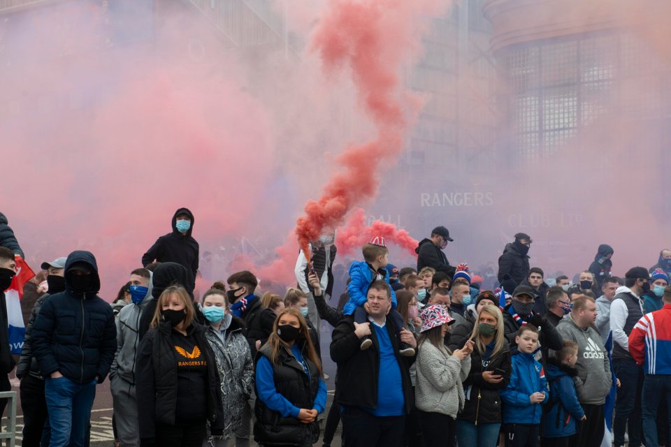 Smoke flares and bombs go off as Rangers fans celebrate their upcoming title