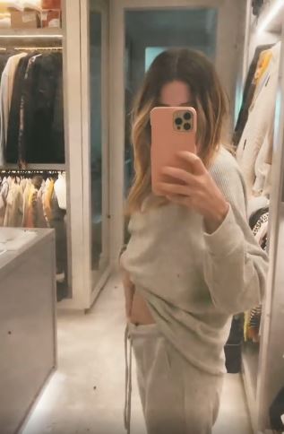 Zoe Sugg shared a video of herself flashing her growing bump