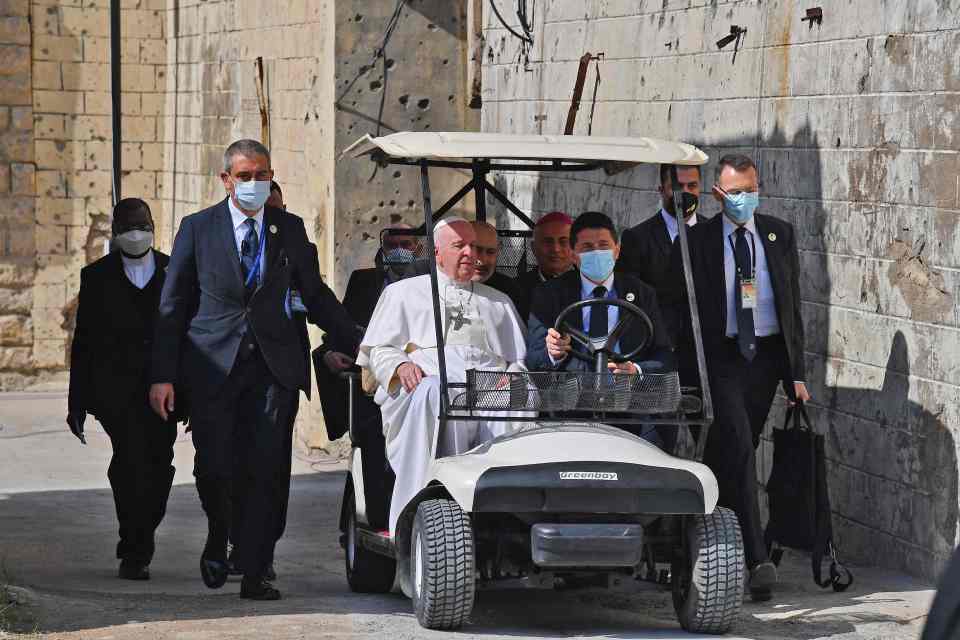 Pope Francis arrives in a golf cart ahead of today's prayers